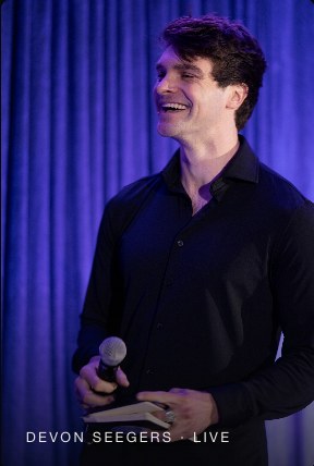 Devon Seegers teaching live, microphone in hand